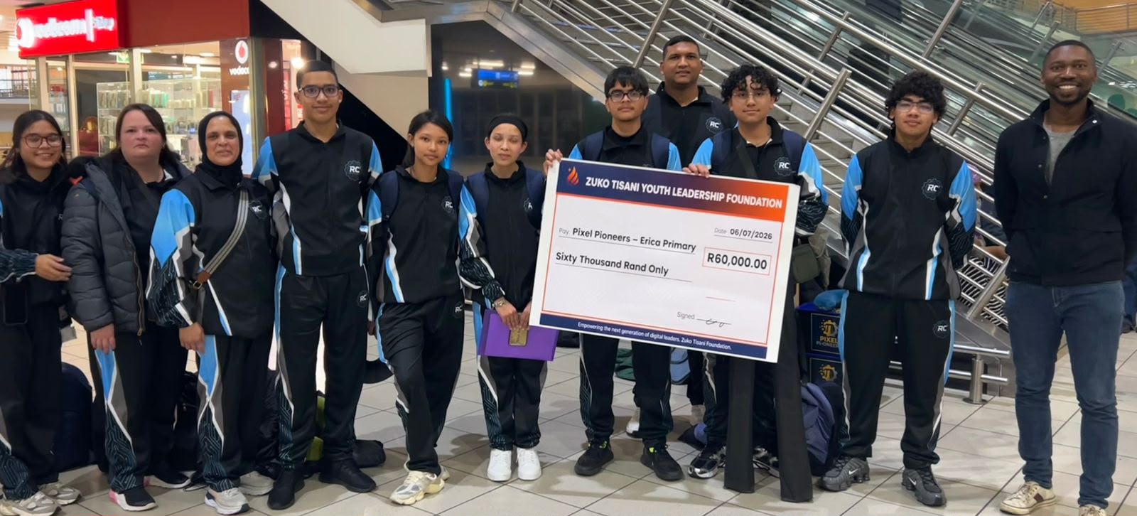 Pixel Pioneers robotics and coding team from Erica Primary School with their Zuko Tisani funding cheque